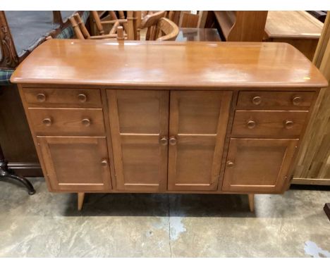 Rare mid-century Ercol sideboard, model 2606i with an arrangement of drawers and cupboards, 130cm wide, 49.5cm deep, 86cm hig
