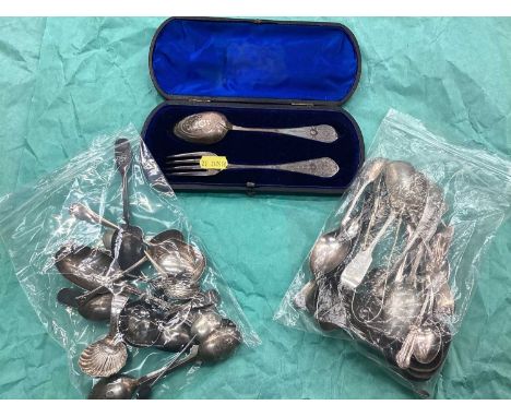 Group of various silver spoons and other cutlery, including two caddy spoons