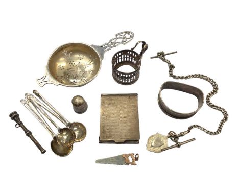 Small group of silver to include a tea strainer, five coffee spoons, matchbook holder, napkin ring and other items