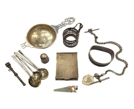 Small group of silver to include a tea strainer, five coffee spoons, matchbook holder, napkin ring and other items