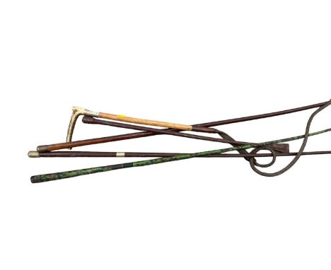Antique riding whip with horn handle and three other whips (4)