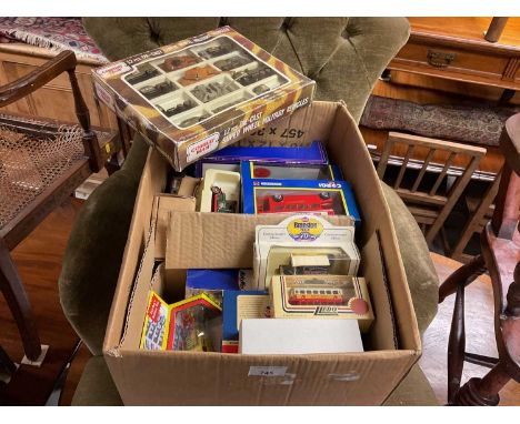 Box of model vehicles and Spider-Man comics