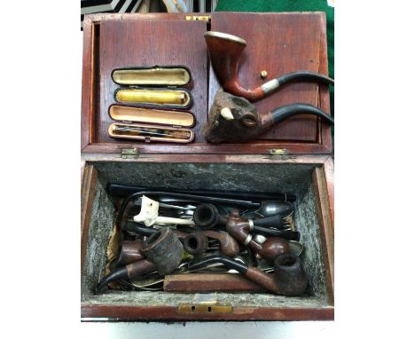 Inlaid tea caddy containing old pipes, cheroot holders, plated cutlery etc