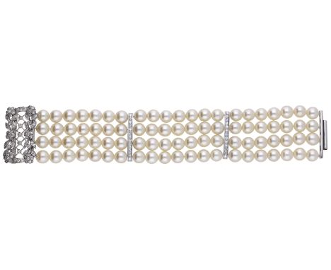 A four row cultured pearl bracelet, the four rows of uniform cultured pearls spaced by two single-cut diamond set vertical ba
