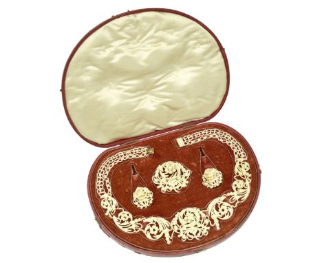 A seed pearl suite, mid 19th century and later, composed of a necklace of graduating scrolling sections, to panel clasp, a br
