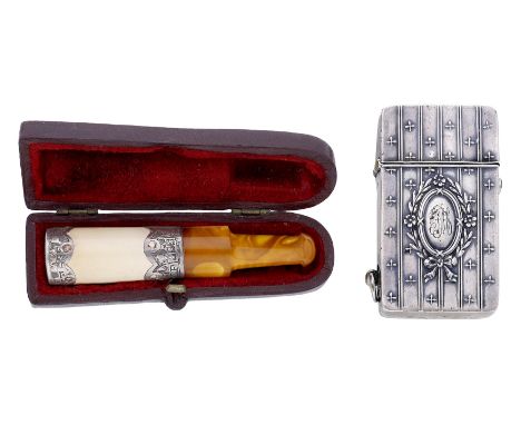 An amber and meerschaum cheroot holder and a silver lighter, the cheroot holder silver mounted, Glasgow hallmark for 1902, fi