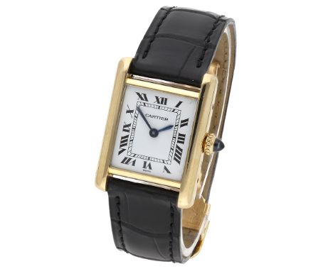 Cartier. A lady’s gold rectangular wristwatch, Tank, circa 1980. Movement: manual winding, 17 jewels. Dial: white, Roman nume