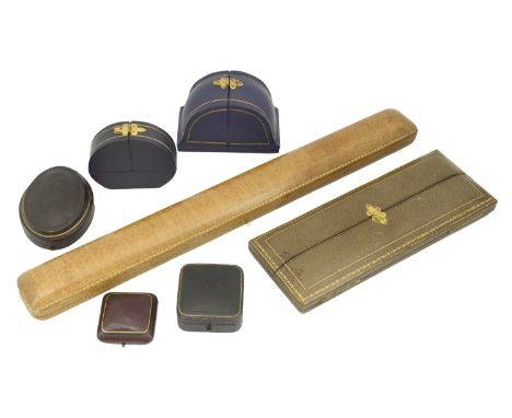 Seven assorted empty leather jewellery cases, comprising an elongated rectangular necklace case by Marcus & Co., New York, a 