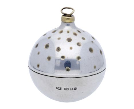 A silver ‘Christmas Surprise’ bauble by Stuart Devlin, 1985, the spherical bauble polished with gilt spot decoration, opening