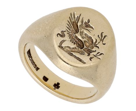 A 9ct gold signet ring, the oval bezel engraved with the crest of a dragon rampant,  London hallmark for 2000, ring size K. £