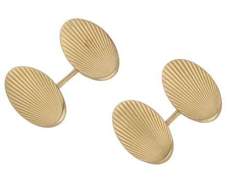 A pair of 18ct gold cufflinks, the oval panels with reeded sunburst decoration, to baton connections, the reverse with partia