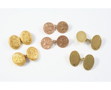 A PAIR OF 9CT GOLD CUFFLINKS of oval form with engine turned decoration , 9.5 grams, together with a pair of 18ct gold cuffli