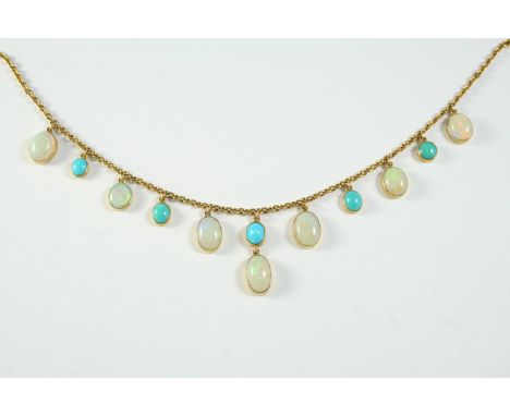 AN OPAL AND TURQUOISE DROP NECKLACE the 9ct gold oval link chain supends seven oval-shaped solid white opal drops and five tu