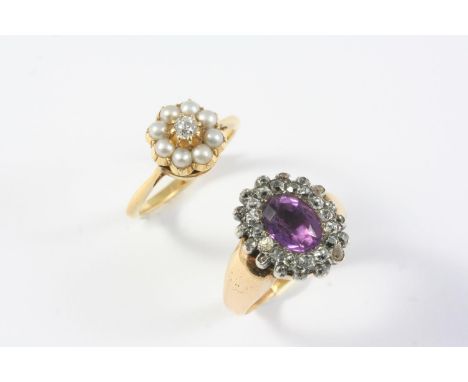 A GEORGIAN AMETHYST AND DIAMOND CLUSTER RING the foil backed oval-shaped amethyst is set within a surround of rose-cut diamon