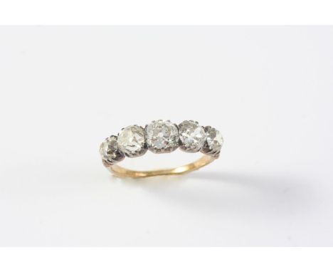 A VICTORIAN DIAMOND FIVE STONE RING the five cushion-shaped diamonds are mounted in silver and gold, with gold shank. Size P