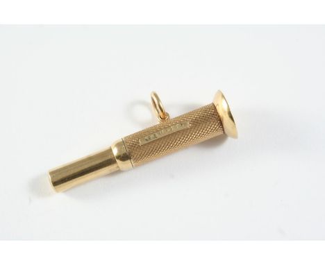 A 9CT GOLD CIGAR CUTTER engraved with engine turned decoration, hallmarked for Birmingham 1975,  maker's initials E B, 9.4 gr