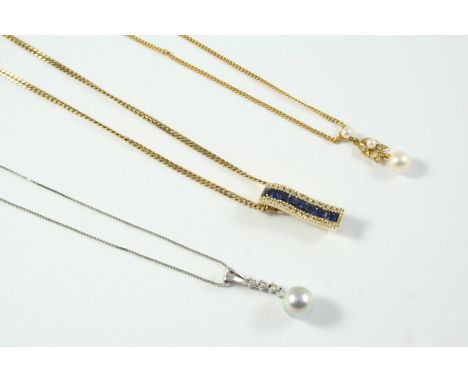 A SAPPHIRE AND DIAMOND PENDANT mounted with square-shaped sapphires within a border of circular-cut diamonds in yellow gold, 