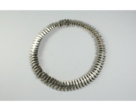 A SILVER NECKLACE BY GEORG JENSEN designed by Hans Hansen, formed with inter-linking discs, with maker's mark for Georg Jense