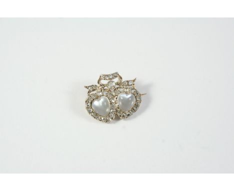 A VICTORIAN MOONSTONE AND DIAMOND DOUBLE HEART BROOCH the two heart-shaped moonstones are set within a surround of rose-cut d