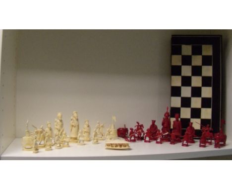 A 19th century Cantonese ivory chess set, an Indian chess board and a Chinese group of the clam's dream, the cinnabar red kin