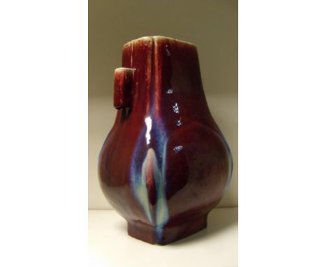 A flambe arrow vase of rectangular sectioned baluster shape, the broader sides of the body with raised peach shapes between l