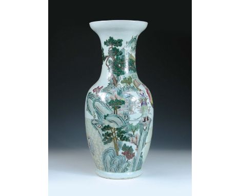 A famille rose baluster vase, the baluster shape painted with monks and immortals in a mountain retreat while two ladies guid