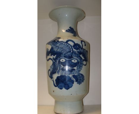 A 19th century blue and white vase, the baluster shape painted with a shishi and three cubs playing with a ribbon tied ball, 