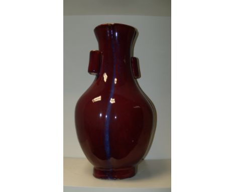 A flambe arrow vase, the flattened baluster shape of quatrefoil section, the glaze deep red but for the indented verticals ha