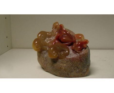 A Shoushan stone frog and lingzhih group, the 'boulder' stippled to a matt surface, the two red amphibians in polished relief