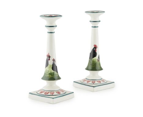 A PAIR OF TALL WEMYSS WARE CANDLESTICKS  'BLACK COCKEREL &amp; HENS' PATTERN, CIRCA 1900   each with impressed mark WEMYSS WA