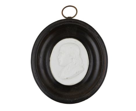 A MINIATURE GLASS PORTRAIT MEDALLION  DATED 1790   inscribed under shoulder A. WAUGH M. A. 1790, framed  3.2cm high