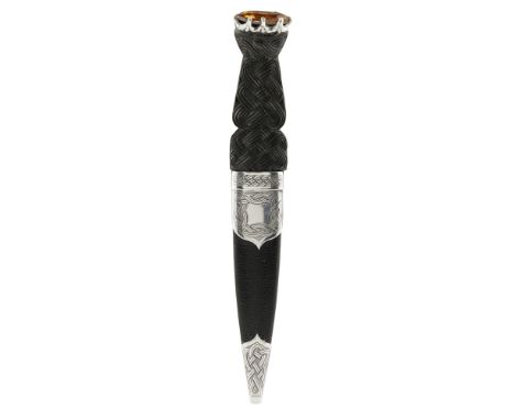 A MODERN SGIAN DUBH  T K EBBUTT, EDINBURGH 1971   the Celtic interlaced handle with claw set paste, leather covered scabbard 