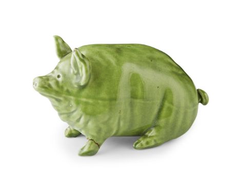 A SMALL WEMYSS WARE PIG  CIRCA 1900   covered in a green glaze, impressed mark WEMYSS WARE/ R. H. &amp; S., repaired foot  16