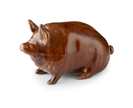 A SMALL WEMYSS WARE PIG  CIRCA 1900   covered in a brown glaze, impressed mark WEMYSS WARE/ R. H. &amp; S.  16cm long