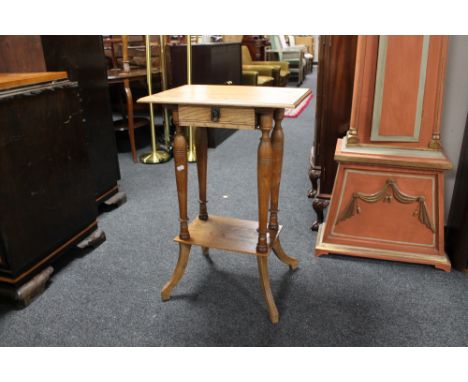 A light oak occasional table fitted a drawer 