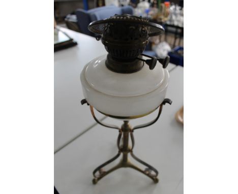 A vintage brass and glass oil lamp