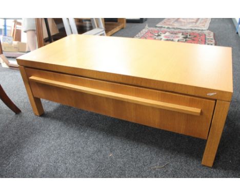 A nest of three tables, a light oak single door cabinet