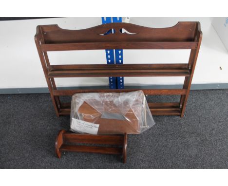 A wooden plate rack together with a book trough and a Swedish wall system 