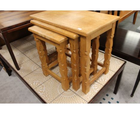 A nest of light oak tables 