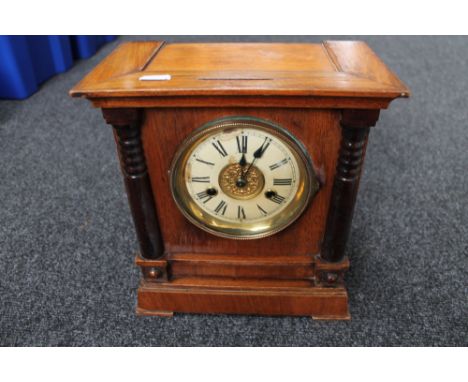 An Edwardian stained pine mantel clock 