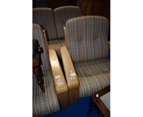 A modern light wood lounge suite comprising two two seater settees and chair having stylised frames