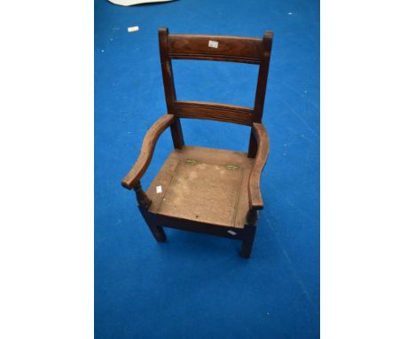 A Victorian oak child's commode chair