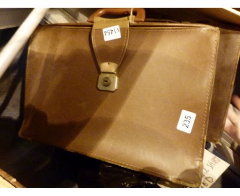 Two leather briefcase style bags and a camera