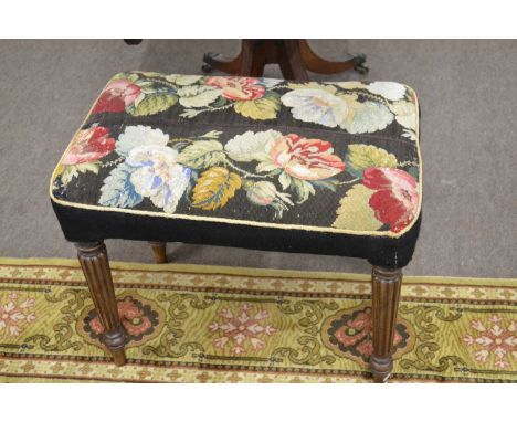 An early Victorian mahogany framed stool of rectangular form set on fluted legs and fitted with tapestry covered top, 60cm wi