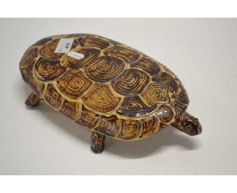 A Majolica model of a turtle in brown glazes, probably French, 30cm long