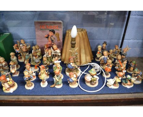 An extensive quantity of Hummel figures made for Goebel, plus an unusual Hummel table lamp