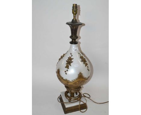 An unusual 20th Century table lamp base, the body formed of opaque glass with metal floral mounts and frosted decoration set 