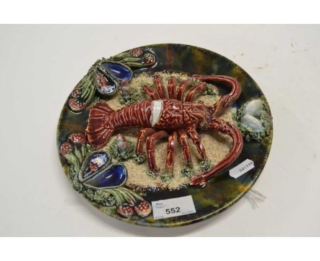 A Palissy type dish with lobster and seashells impressed factory mark to base, probably Portuguese, 24cm diameter