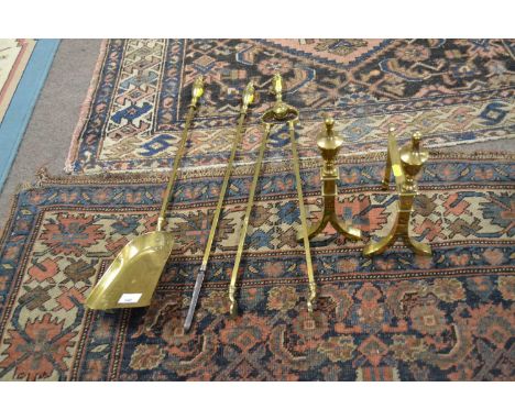 A set of three Victorian brass fire tools together with accompanying pair of stands (5)
