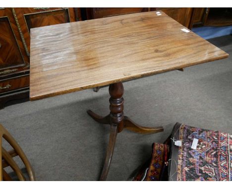 A small Georgian mahogany table with rectangular snap top over a turned column and tripod base, 70cm wide